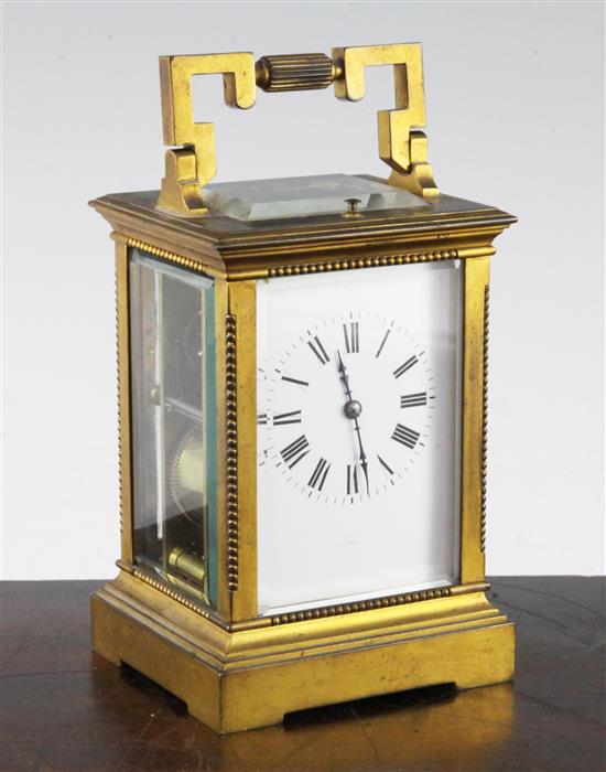 An early 20th century French gilt brass hour repeating carriage clock, 6.5in.